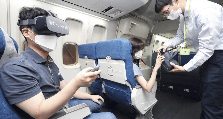 Passengers experiencing VR headsets from JinAir