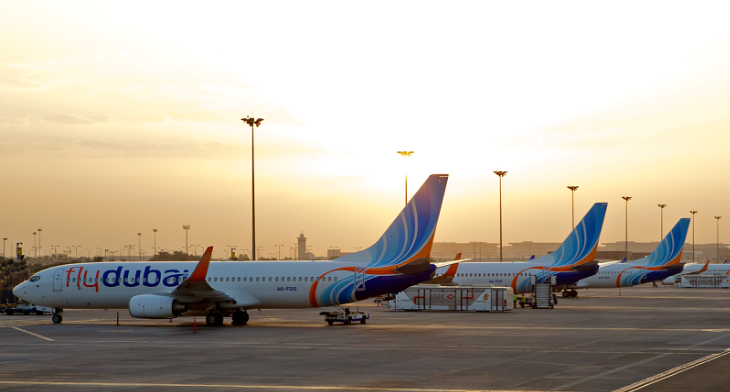 flydubai parked aircraft at sunset